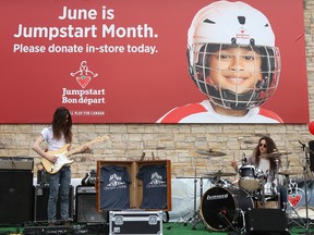 Oshawa-based musical act, Crown Lands, perform in front of Canadian Tire for Jumpstart Day on Saturday May 27, 2017 in Belleville, Ont. Jumpstart Day is the fundraising kickoff for the Jumpstart program which helps get children involved in sports and activities. Tim Miller/Belleville Intelligencer/Postmedia Network