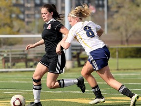 Julia Foss, left, and the Northern Vikings have qualified for the 2017 OFSAA 'AAA' girls soccer championship. Foss is shown protecing the ball from Chatham-Kent Golden Hawks' Hunter Gagner in the second half of the LKSSAA 'AAA' senior girls soccer final at Norm Perry Memorial Park in Sarnia, Ont., on Thursday, May 18, 2017. (MARK MALONE/Postmedia Network)