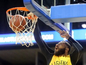 Royce White of the London Lightning dunks the first two points for the Lightning during the first game of their league championship playoff against the Halifax Hurricanes at Budweiser Gardens in London. (MIKE HENSEN, The London Free Press)