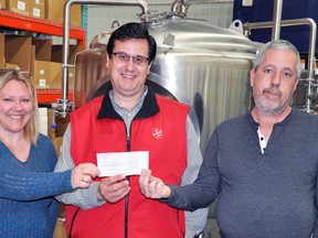 Patrick and Angela Walker, of Ontario Beer Kegs in Mitchell, recently donated more than $5,100 to Barry Clarke (middle) of the Salvation Army of Stratford and Area, to aid in the replenishing of the West Perth food bank. ANDY BADER/MITCHELL ADVOCATE