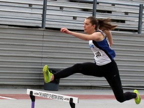 Frida Kapstad, an exchange student from Norway, competes in the senior girls 400-metre hurdles at the WOSSAA track and field championships in London May 18. She finished with the silver medal and qualified for the OFSAA West event last week, also in London. SUBMITTED