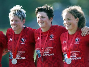 Team Canada's Breanne Nicholas, right, of Blenheim, Brittany Benn and Jennifer Kish wear silver medals after losing to New Zealand 17-7 in the final at the HSBC World Rugby Women's Sevens Series tournament at Westhills Stadium in Langford, B.C., on Sunday, May 28, 2017. (CHAD HIPOLITO/The Canadian Press)
