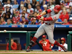 Cincinnati Reds' Joey Votto hits a run-scoring ground out against Philadelphia Phillies starting pitcher Aaron Nola during the first inning of a baseball game, Friday, May 26, 2017, in Philadelphia. (AP Photo/Matt Slocum)