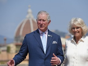 Britain's Prince Charles, Prince of Wales, and the Duchess of Cornwall, Camilla, pose on the terrace of the Palazzo Pitti after a meeting with representatives from Woolmark and the Campaign for Wool, on April 3, 2017 in downtown Florence. (TIZIANA FABI/AFP/Getty Images)