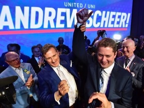 Andrew Scheer, right, is congratulated by Maxime Bernier after being elected the new leader of the federal Conservative party at the federal Conservative leadership convention in Toronto on Saturday, May 27, 2017. THE CANADIAN PRESS/Frank Gunn