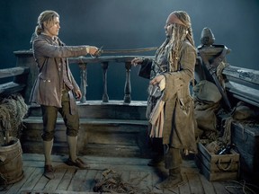 Brenton Thwaites (Henry) and Johnny Depp (Captain Jack Sparrow) in "Pirates of the Caribbean: Dead Men Tell No Tales." MUST CREDIT: Peter Mountain, Walt Disney Studios
