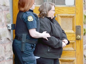 Former nurse Elizabeth Wettlaufer leaves the courthouse in Woodstock, Ontario on Friday April 21, 2017 to face charges of multiple murders in the unexplained deaths of area senior citizens. (MORRIS LAMONT, The London Free Press)