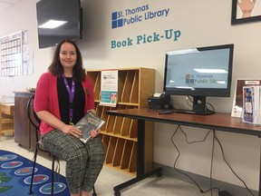 Sarah Macintyre, manager of access services with the St. Thomas Public Library, sits next to the newly-installed self-checkout station at the Northside Neighbourhood Hub, which people will be able to use to checkout library materials at the new location. (JONATHAN JUHA/TIMES-JOURNAL/POSTMEDIA NETWORK)