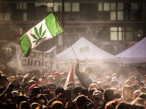 In this April 20, 2016, file photo, people smoke marijuana during a 4/20 cannabis culture rally in Toronto. (Mark Blinch/The Canadian Press via AP, File)
