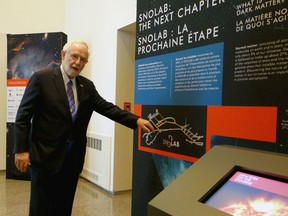 Professor emeritus and Nobel laureate Arthur McDonald leads a guided tour through the New Eyes on the Universe exhibit at the Agnes Etherington Art Centre. The exhibit is running until July 7. (Amanda Norris/For The Whig-Standard)