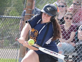 Kendra MacMillan of the College Notre Dame Alouettes hits the ball during the senior girls high school division A slo-pitch championship game in Sudbury, Ont. on Monday May 29, 2017. Gino Donato/Sudbury Star/Postmedia Network