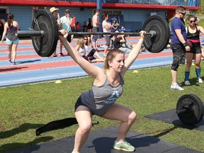 Christina Williams competes in the CrossFit Sudbury Battle Beyond the Barbell charity competition at the track at Laurentian University in Sudbury, Ont. on Saturday May 27, 2017. The competition, which raises money for the Janis Foligno Foundation, featured 96 competitors from across Ontario. The foundation supports various initiatives and charities to fight cancer in Greater Sudbury. John Lappa/Sudbury Star/Postmedia Network