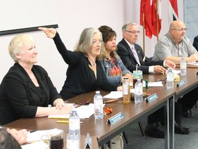 BRUCE BELL/THE INTELLIGENCER
The Hastings and Prince Edward District  School Board trustees heard from 25 delegates last night at the board office as part of the Belleville area Accommodation Review. Pictured is trustee Jennifer Cobb giving delegates instructions.