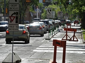 Traffic crawls along 100 Avenue near 105 Street as bike lane installations continues in Edmonton on May 29, 2017. Ed Kaiser / Postmedia