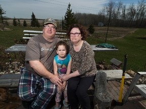 Dan Merriam, daughter, Deeyah ,6, and wife Marilyn are pushing back against a proposed high-end gun range located a few hundred yards from there home, proposed by Kloovenburg Sports Ltd. Taken on Wednesday May 3, 2017, in Edmonton.  Greg Southam / Postmedia