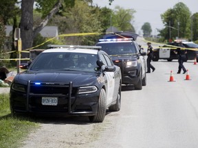 The OPP were investigating after an altercation between two men at a home on the corner of Oneida Road and Fairgrounds Road on the Oneida Settlement near London, Ontario sent both to hospital on Sunday May 28, 2017. (DEREK RUTTAN, The London Free Press)