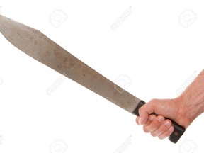 hand holding machete
