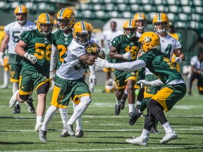 Running back Kendial Lawrence runs the ball up field. The Edmonton Eskimos practiced at Commonwealth Stadium on May 30, 2017 to prepare for their first pre-season game on June 11.