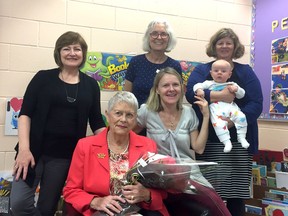 Ontario Early Years Centre in Kingston receives a book donation on Monday. Front, from left, are private donor Janice Sutton and Kristen Watkins, and back, from left, are Joanne Morrissey, Debbie Nesbitt-Munroe, Cheryl Wilson and baby Lennox Link. (Joe Cattana/For The Whig-Standard)
