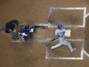 Toronto Blue Jays' Ryan Goins hits a grand slam during the sixth inning of an MLB against the Milwaukee Brewers on May 24, 2017. (AP Photo/Morry Gash)