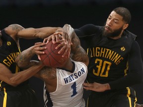 Tyrone Watson of the Halifax Hurricanes is shut down by Marcus Capers and Royce White of the London Lightning during Game 3 of the NBL of Canada final Tuesday in Halifax. (Mike Dembeck/Special to the London Free Press)