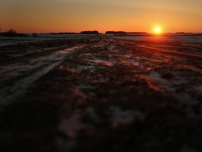 The sun rises on Boundary Road in Emerson, Man. (John Woods/The Canadian Press/Files)