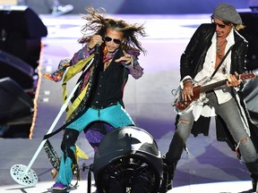 Singer Steven Tyler, left, and guitarist Joe Perry perform during a concert of Aerosmith at the Koenigsplatz in Munich, Germany, Friday, May 26, 2017. (AP Photo/Lukas Barth)