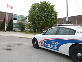 Greater Sudbury Police detectives and school resource officers were on hand at Lockerby Composite School on Wednesday after a hand-written note was found on the floor threatening that a shooting would occur. (Gino Donato/Sudbury Star)