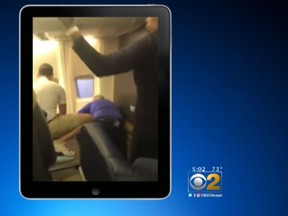 A cell phone video shows crew members from a Southwest Airlines flight subduing a passenger that tried to re-board a flight on Monday night. (Screen capture/CBS Chicago)