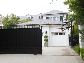 The front gate of a home belonging to Cleveland Cavaliers' LeBron James is freshly repainted Wednesday, May 31, 2017, in Los Angeles. (AP Photo/Damian Dovarganes)