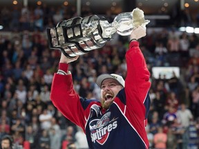 Windsor Spitfires centre Aaron Luchuk, who scored the game-winning goal, raises the trophy after defeating the Erie Otters to win the Memorial Cup in Windsor. The Kingston native was traded to Barrie this week. (THE CANADIAN PRESS/Adrian Wyld)