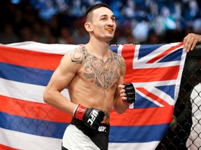 In this Dec. 12, 2015 file photo, Max Holloway warms up before fighting Jeremy Stephens in a featherweight mixed martial arts bout at UFC 194 in Las Vegas. (AP Photo/John Locher, File)