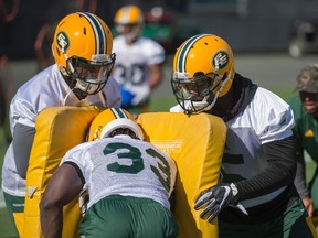 Fullback Johnny Agustin runs through the pads. The Edmonton Eskimos practiced at Commonwealth Stadium on May 30, 2017 to prepare for their first pre-season game on June 11.