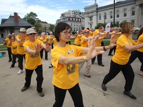 Nanette Bak goes through movements during a tai chi demonstration by the Kingston’s Taoist Tai Chi branch on Wednesday at Confederation Park. The branch is celebrating its 40th anniversary this year. (Ian MacAlpine/The Whig-Standard)