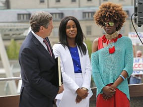 Toronto Mayor John Tory and Pride co-chairman Alica Hall spoke about inclusion during Wednesday's rainbow flag-raising to kick off Pride month, but we're not sure how any of them had the gall to mention the word when they've excluded Toronto's police force from the upcoming Pride parade. (MICHAEL PEAKE/TORONTO SUN)