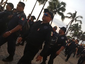 Members of the Puerto Vallarta police department proudly participate in the Vallarta Pride parade. (NELSON BRANCO/POSTMEDIA NETWORK)