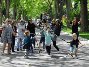 Residents on 126 Street in the Westmount community of Edmonton play on the street in front of their homes. Larry Wong / Postmedia