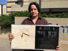 Artist Wayne Ashley is giving artwork to the Edmonton Police Service on Wednesday, May 31, 2017, to send to London, England, to honour fallen officers. The presentation was days before the second anniversary of the slaying of former British bobby, EPS Cont. Daniel Woodall. Juris Graney / Postmedia