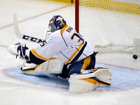 The puck shot by Penguins forward Jake Guentzel lands in the net behind Predators goalie Pekka Rinne for a goal during the third period in Game 2 of the Stanley Cup final in Pittsburgh on Wednesday, May 31, 2017. (AP Photo/Gene J. Puskar)