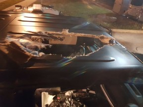 Damage to a vehicle after a cinder block was thrown onto Hwy. 401 from the Progress Ave. overpass on Sunday around 10 p.m.