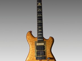 In this undated photo provided by Guernsey's, Jerry Garcia's famous "Wolf" guitar is shown. Garcia's custom-made guitar is truckin' to auction in New York City. Guernsey's auction house says it'll be offered Wednesday, May 31, 2017, at Brooklyn Bowl, a bowling alley, restaurant and venue for music shows. The proceeds will go to the Alabama-based Southern Poverty Law Center. (Guernsey's via AP)