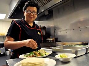 Ana Rivas, head chef at True Taco on Dundas Street, prepares a trio of authentic Mexican tacos. True Taco is one of eight local restaurants taking part in Fiesta London June 3. CHRIS MONTANINI\LONDONER\POSTMEDIA NETWORK