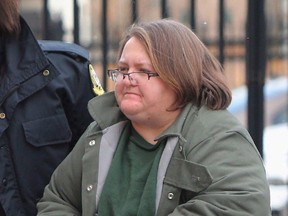 Elizabeth Wettlaufer is escorted into the courthouse in Woodstock in this January file photo. (The Canadian Press files)