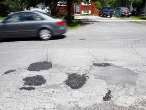 LUKE HENDRY PHOTOS/THE INTELLIGENCER
A car passes some of the many patches along Avondale Road in Belleville Thursday. It's ranked the fifth-worst road in eastern Ontario in the CAA's 2017 Worst Roads report. Prince Edward County Road 49 was worst regionally and 10th-worst provincially.