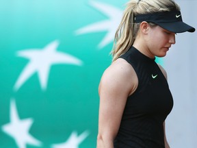 Canada's Eugenie Bouchard misses a shot against Latvia's Anastasija Sevastova during their second round match of the French Open at the Roland Garros stadium in Paris on June 1, 2017. (AP Photo/David Vincent)