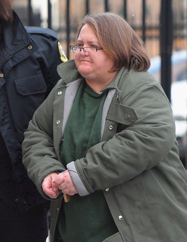 Elizabeth Wettlaufer is escorted into the courthouse in Woodstock in this January file photo. (Dave Chidley/The Canadian Press)