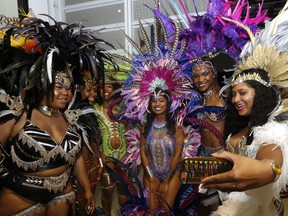Dancers work on some selfies behind the scenes at the Ontario Science Centre during a media preview on Thursday, June 1 ahead of the 50th Toronto Caribbean Carnival, which starts July 11. (MICHAEL PEAKE/TORONTO SUN)