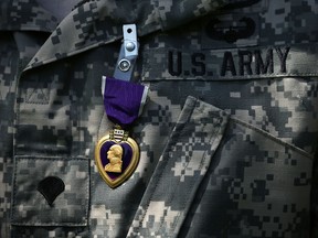 A Purple Heart medal is seen pinned on a recipient's uniform during a Purple Heart ceremony in Mount Vernon, Va., on June 9, 2015. (Alex Wong/Getty Images)