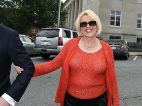 Brooke Covington, a member of the Word of Faith Fellowship church in Spindle, N.C., leaves a hearing at Rutherford County Courthouse in Rutherfordton, N.C., on May 19, 2017. (AP Photo/Kathy Kmonicek)