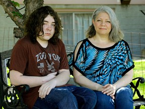 Lisa Phillips-Cardinal (right) and her son Michael (left/17-years-old). Michael has a chronic debilitating pain condition that he developed after receiving acetaminophen at a hospital when he was 15-years-old. He had a known allergy to it and the drug permanently damaged his central nervous system. Entertainer Oscar Lopez will play a benefit concert for the Phillips-Cardinal family. PHOTO BY LARRY WONG/POSTMEDIA